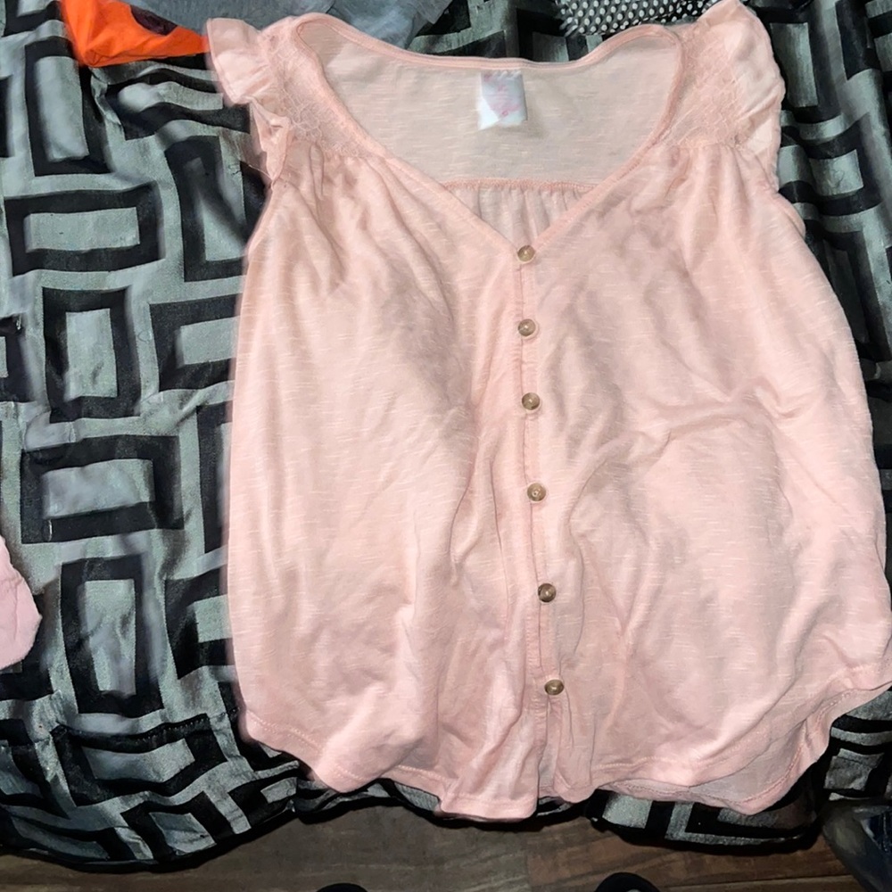 Two different shirts, both pink